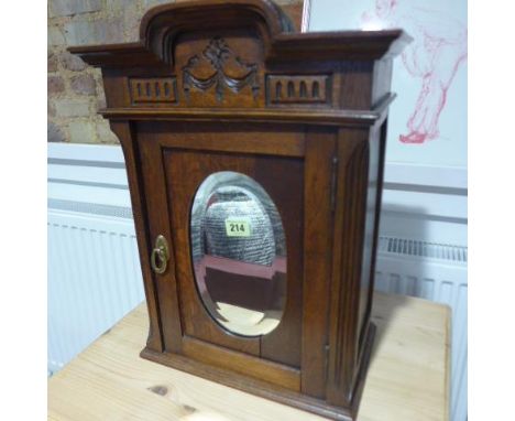 An oak hanging cabinet with a mirror door - Height 49cm x Width 36cm 