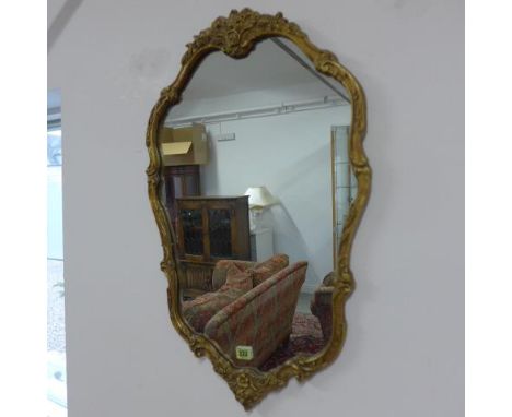 An ornate wall mirror - Height 73cm x Width 45cm 