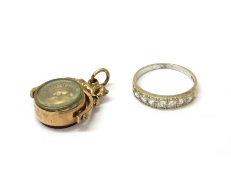 A 9ct white gold paste half eternity ring, Birmingham 1976, 3.24g, together with a rolled gold equestrian spinner fob, with a
