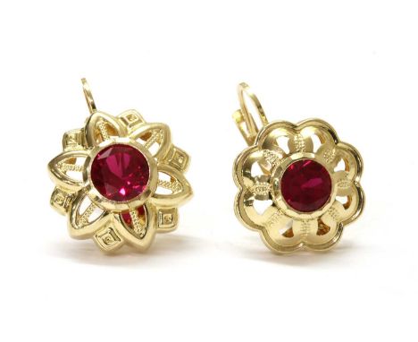 A pair of 14ct gold synthetic ruby asymmetric earrings, with a circular mixed cut synthetic ruby, approximately 6.0mm and 6.5