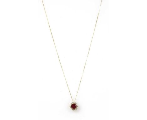 A gold fracture filled ruby and diamond cluster pendant, with a circular mixed cut fracture filled ruby, approximately 6mm, c