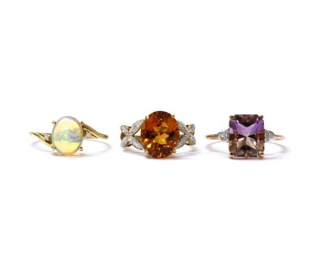 A 9ct gold ametrine and diamond ring, with an octagonal mixed cut ametrine, approximately 11 x 9mm, and eight cut diamonds gr