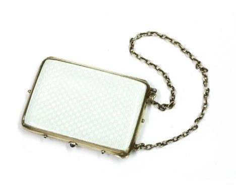 A silver gilt and enamel, sapphire set evening purse, with white enamelled covers, trace chain handle and sapphire set thumbp
