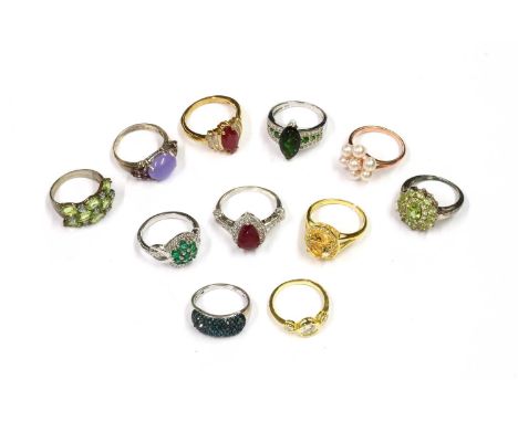 A quantity of silver and silver gilt gem set rings, to include a tapered band ring pavé set with treated blue diamonds, one d