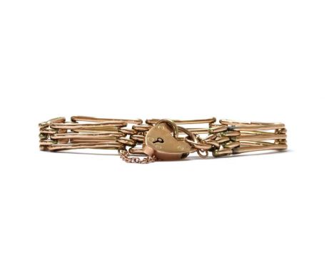 A gold gate bracelet, with heart shaped padlock clasp, tested as approximately 9ct gold, 8.88gCondition report: Links very wo