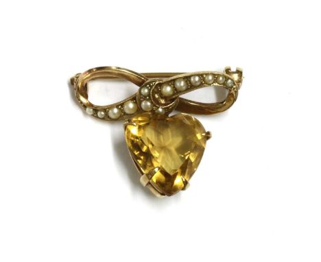 A gold citrine and split pearl brooch, with a heart shaped mixed cut citrine claw set to an articulated collet, surmounted by