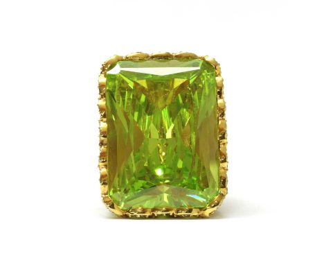 A silver gilt cubic zirconia cocktail ring, with an octagonal mixed cut green cubic zirconia, approximately 36 x 26mm, to pie