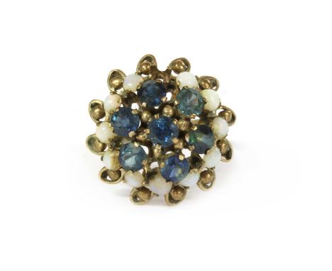 A Thai gold sapphire and opal ring, with a central cluster of circular mixed cut sapphires, to outer row of circular cabochon