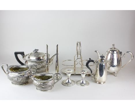 A Walker and Hall silver plated two-bottle cruet stand, a silver plated teapot (a/f) with matching sugar bowl and cream jug, 