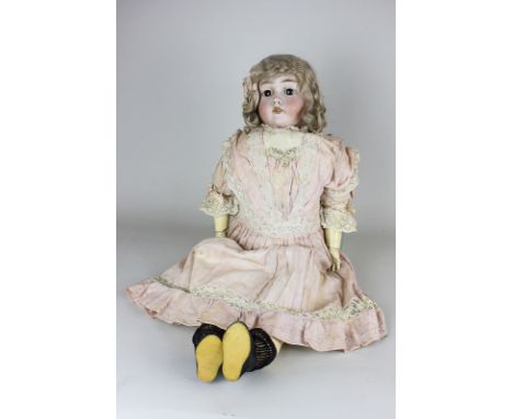 A German bisque head doll with blond hair, sleeping brown eyes and open mouth, marked MAX Handwerck Germany 2 1/4, composite 