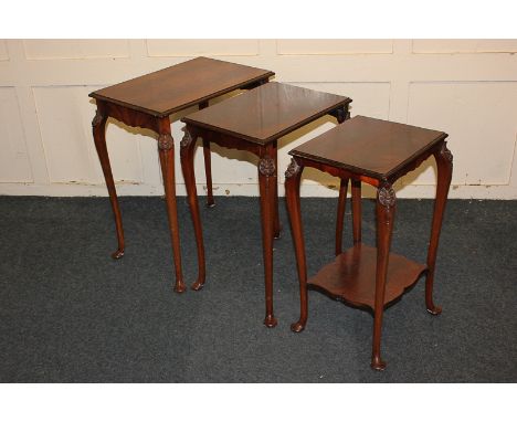 A nest of three mahogany occasional tables on shell carved slender cabriole legs, the smallest table with under shelf, 53.5cm