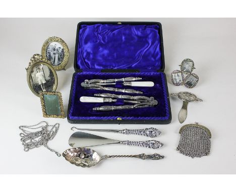A Victorian silver handled shoe horn and button hook, a cased set of a pair of silver plated lobster crackers and mother of p