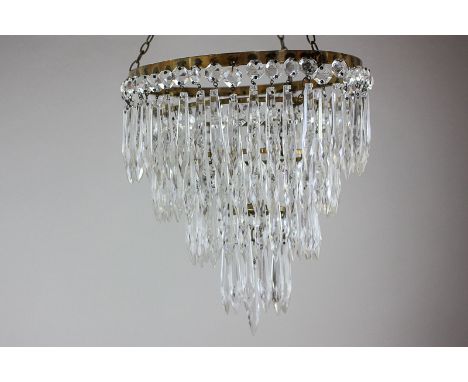 A cut glass and gilt brass four-tier light shade, 25cm