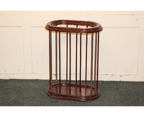 An oval stick stand with metal and wooden spindle supports, 47.5cm