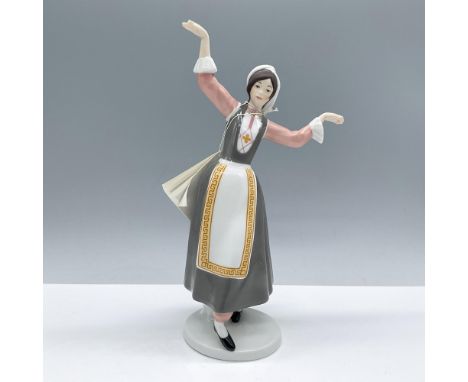 Beautiful glazed figure with matte hands, face and hair. Features a young woman dressed in Swiss native costume decorated wit