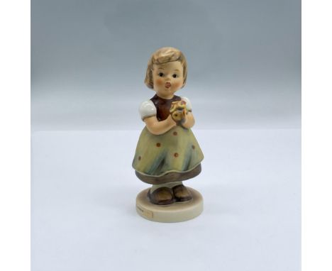 Beautifully hand painted porcelain of an adorable young girl holding a floral bouquet. Backstamped with Goebel Hummel W. Germ