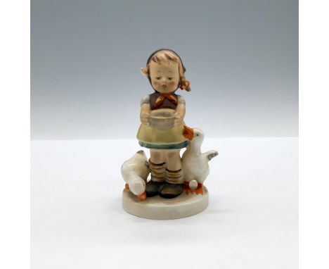 A hand painted matte figure of a girl holding a bowl of food for her hungry ducks who are impatiently waiting. Goebel backsta