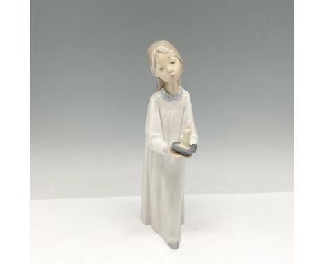 Glossy figure in night dress holding candle. Lladro backstamp. This item has its original box: 10"L x 5"W x 3.5"H. Artist: Fu