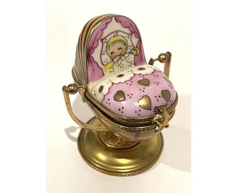 Highly Detailed Hand painted fine porcelain mini box with baby girl in Pink baby crib in pinks soft melon and gold that rocks