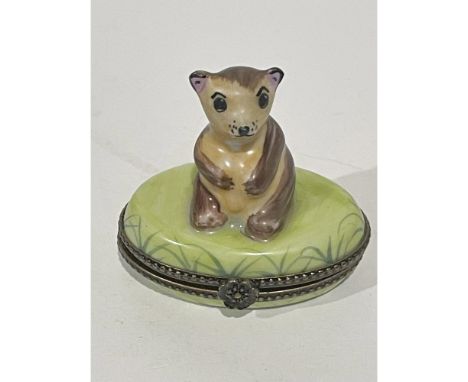 Precious Beige and Brown sitting Honey Bear on hinged egg shaped soft green porcelain treasure box that is beautifully detail