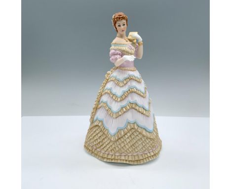 Finely decorated matte porcelain lady figurine with gilt accents and Lenox backstamp on the bottom. Issued: 1986Dimensions: 4