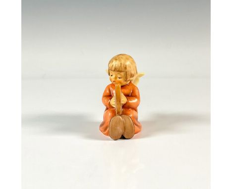 A figure of a sweet angel wearing a red dress and playing the harp. M.I. Hummel impressed. Goebel backstamp. Issued: 1984Dime