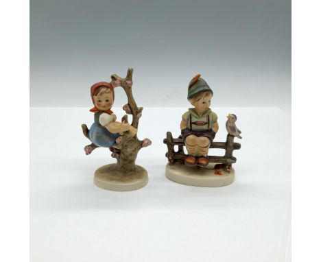 Includes two matte hand painted figures, a girl sitting in a tree decorated with pink flowers (HUM141 3/0), and boy sitting o
