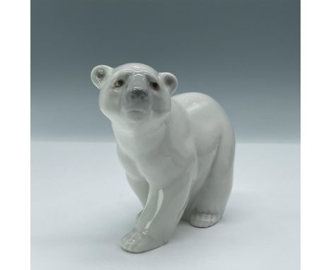 Glazed figural of white bear with gray face and inset eyes. Lladro backstamp. Artist: Juan HuertaIssued: 1972-2021Dimensions: