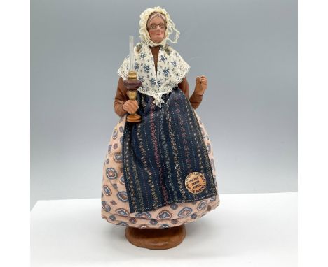 Exquisite hand crafted figure from the Provence region of France. Features intricate detailing with fabrics and painted detai