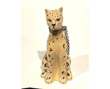 Rare color, stylized and sleek. Intricately detailed seated realistically hand painted Snow Leopard, finished with a gilt tri