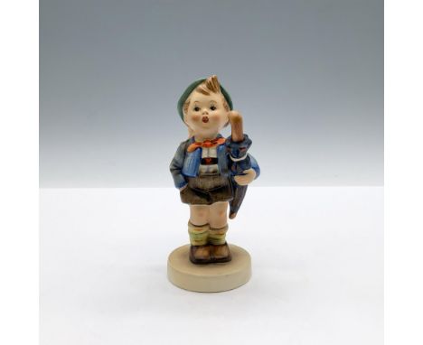 A matte hand painted figure of a boy carrying an umbrella under his arm, and a pig inside a basket on his back. Goebel backst
