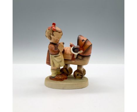 A matte hand painted sculpture depicting a young girl who is praying next to a stroller holding a doll. Goebel backstamp. M.I