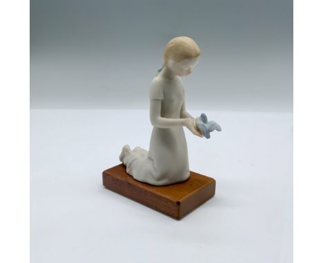 Fine porcelain figurine of a girl holding a bird. Cybis mark near the base. Artist: Patricia EakinIssued: 20th c. Dimensions: