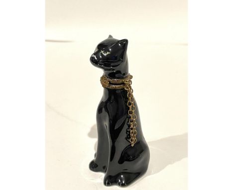 Rare, stylized and sleek. Intricately detailed seated hand painted Black Panther, finished with a gilt trim collar replete wi