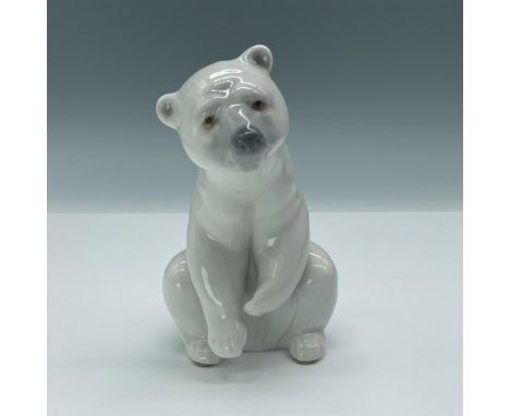 This adorable figurine depicts a majestic polar bear in a resting position. Lladro backstamp. Artist: Juan HuertaIssued: 1972