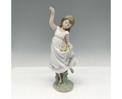 Glossy figure dancing and picking up flowers from the field. Colored in white, pink, blue and green. Lladro backstamp. This i