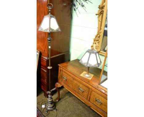 An early 20th century American patinated metal table lamp, by Edward Miller & Co, with an hexagonal amber leaded slag glass s