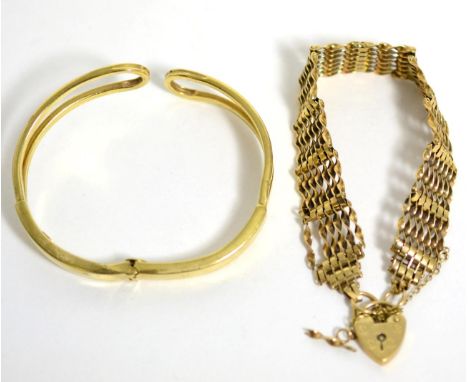 A 9 carat gold gate link bracelet (a.f.) and a hinged bangle stamped '375' (2)29.6g gross