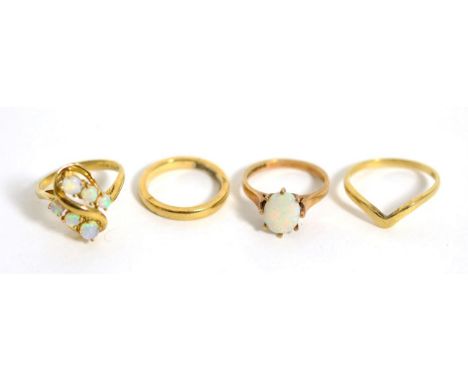 A 9 carat gold opal cluster ring, finger size M1/2, a 9 carat gold band ring, finger size J, a 9 carat gold wishbone ring and