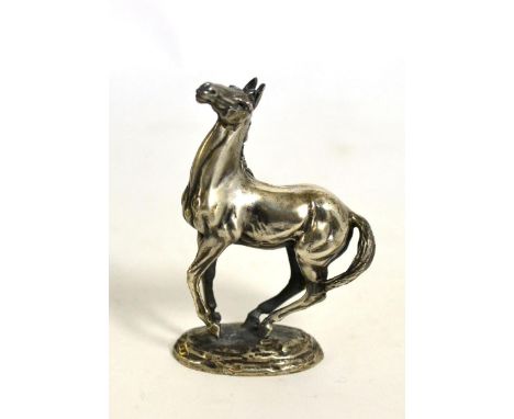 A cast silver model of a horse ''Playing Up'' by Lorna McKean, for The British Horse Society, English import marks, John Pinc