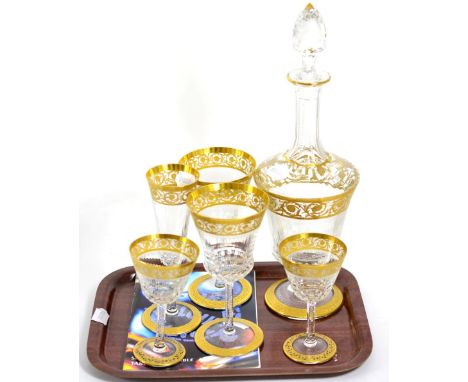A Saint Louis Thistle pattern decanter, two red wine goblets; two white wine goblets and a champagne flute en suite 