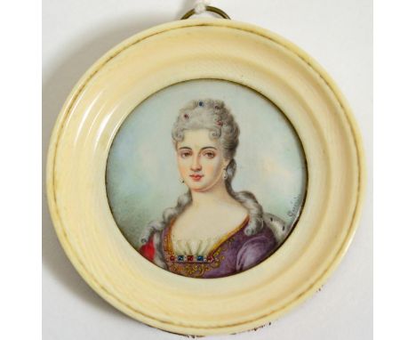 After Jean Urbain Guerin: A miniature bust portrait of a late 18th century lady, 4cm circular, in an ivory frame  