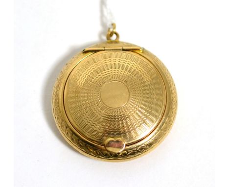 A 9 carat gold engine turned compact pendant, 4.5cm in diameter 18.4g