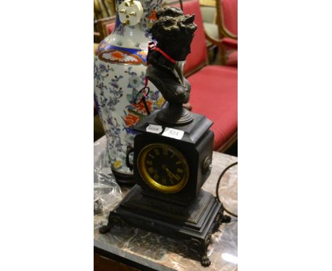 A 19th century Belgian black slate mantel clock with gilt dial, mounted with a spelter bust of a young lady