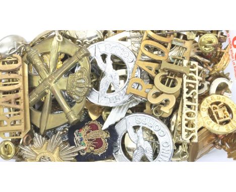 A large quantity of 20th century cap badges, Officers pips, uniform buttons and shoulder titles. P&amp;P Group 2 (£18+VAT for