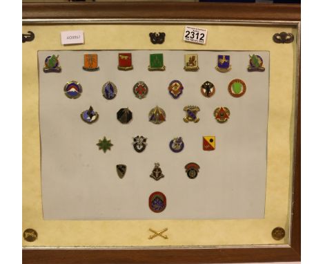 Display of twenty seven enamelled military division badges. (Posted excluding the frame). P&amp;P Group 2 (£18+VAT for the fi