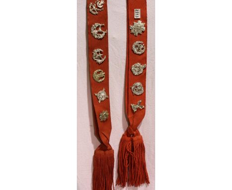 Ten Highland Regiment Glengarry badges on two parade sashes. P&amp;P Group 1 (£14+VAT for the first lot and £1+VAT for subseq