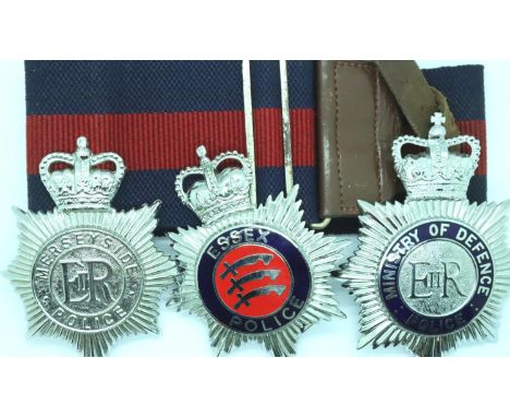 Three helmet plates; Merseyside Police, Essex Police and MOD Police with belt. P&amp;P Group 2 (£18+VAT for the first lot and