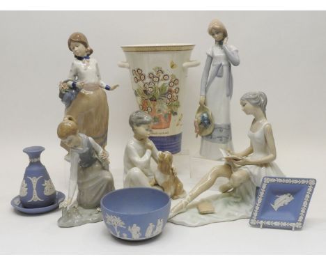 A Lladro figure of a girl picking flowers, together with a further Lladro figure of a boy with a puppy, further Lladro type f