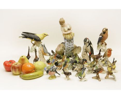 A collection of Goebel birds, twenty four, a selection of six fruit models, and a figure of a lady with chickens and turkey